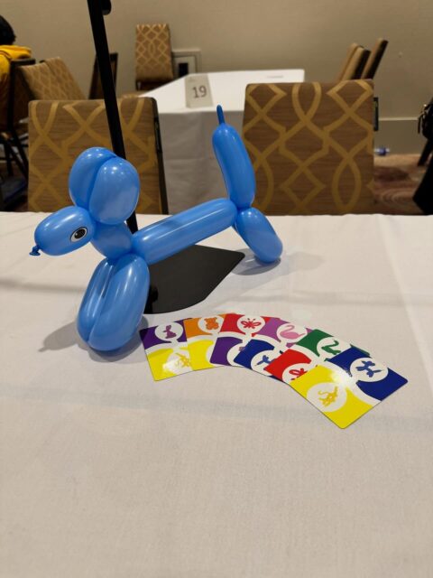 Even “finished” games can be improved. I introduced 99 Balloons to 12 groups of people at @breakoutcon this weekend! It was both fun, and insightful!
After running 9 tournaments, and solely acting as the balloonist (running the central market) I realized this should be a separate role. I’ve played the game many times now, but I’ve always run the table AND played. It’s challenging, to say the least.
As a dedicated balloonist, I can choose which colour to play into the market, and mess with the other players! This role can now be separated, and rotates each round. No more juggling, and agency for all players. I’ll be changing the rules for everyone to enjoy.
I’m extremely thankful to have had the opportunity to run these tournaments and continue to improve the game. Also, I’m thankful that my rules are accessed via a QR code so that all players can now enjoy the new way to play!
#boardgamerules #rules #boardgamedev